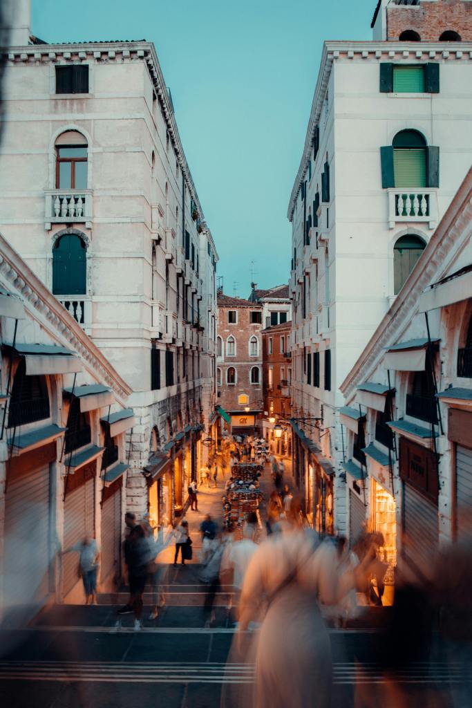 Busy street in Italy with blurred people walking